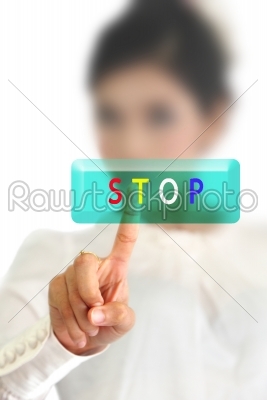 woman hand pressing stop button on a touch screen