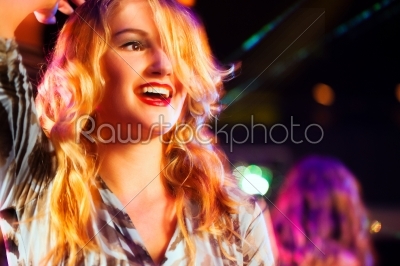 Woman in club or bar having fun
