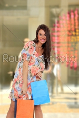 Woman in front of a shop Window