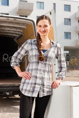 Woman in front of moving truck