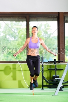 Woman jumping with rope, jumping rope