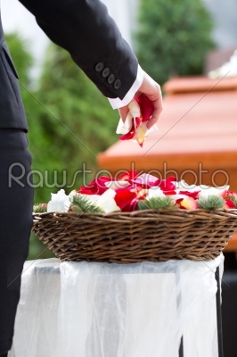 Woman mourning on Funeral with coffin