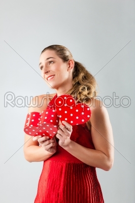Woman opening present for valentines day