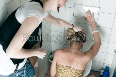 Woman throwing up in the toilet