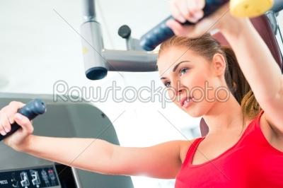 Woman training in gym or sport center