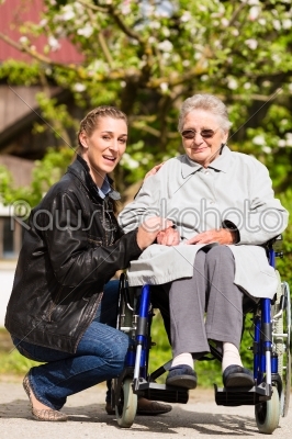 woman visiting grandmother in nursing home