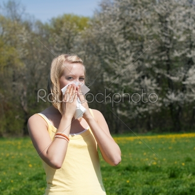 Woman with allergy sneezing