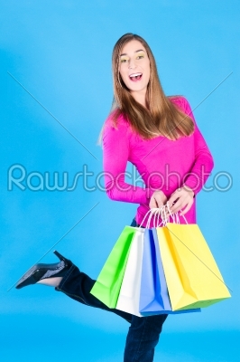 woman with colored shopping bags