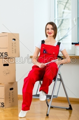 Woman with moving box in her house