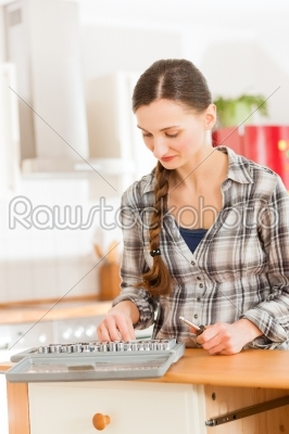 Woman with toolbox and screwdriver