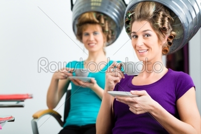 Women at the hairdresser hair being dried