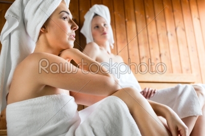 women in wellness spa enjoying sauna infusion
