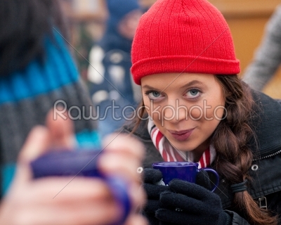 Women on Christmas market drinking punch