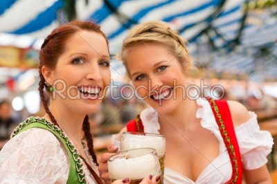 Women with traditional Bavarian clothes or dirndl in beer tent