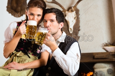 Young couple in a hunters cabin