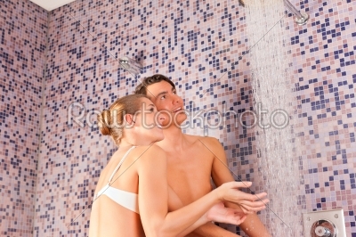 Young couple under experience shower