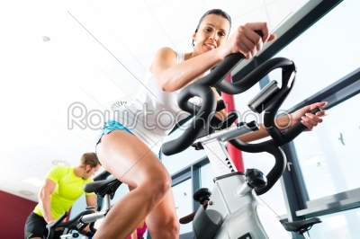 Young People Spinning in the fitness gym