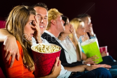 Young people watching movie at movie theater