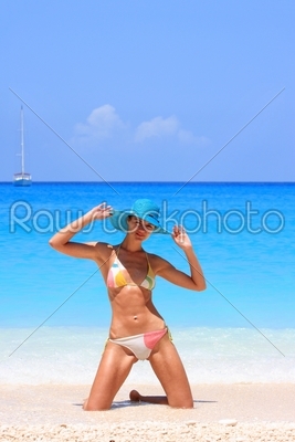 Young sexy woman posing on the beach