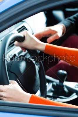 Young woman at driving lesson