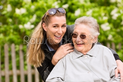 Young woman is visiting her grandmother in nursing home