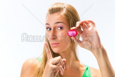 Young woman with a condom