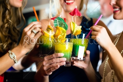 Young women with cocktails in club or Bar