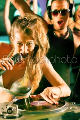 stock photo: two djs at the turntable in club-Raw Stock Photo ID: 40367