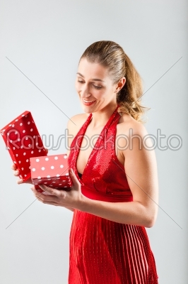 stock photo: woman opening the gift and is happy-Raw Stock Photo ID: 43821