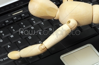 stock photo: wood mannequin and laptop-Raw Stock Photo ID: 30801