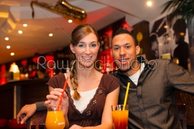 stock photo: young couple drinking cocktails in bar or restaurant-Raw Stock Photo ID: 44398