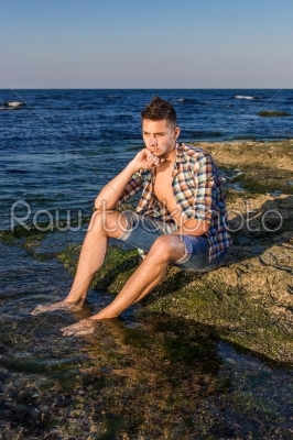 stock photo: attractive young fashion sexy man on rock near the sea water-Raw Stock Photo ID: 67645