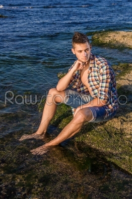 stock photo: attractive young fashion sexy man on rock near the sea water-Raw Stock Photo ID: 67647