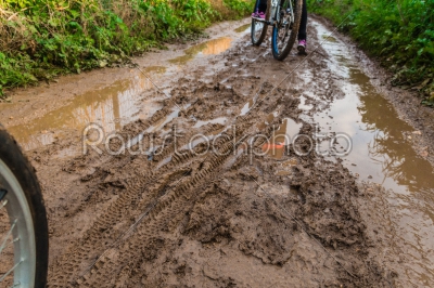 stock photo: bicycle ride through muddy dirt road-Raw Stock Photo ID: 75137