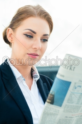 stock photo: businesswoman reading business newspaper-Raw Stock Photo ID: 49746
