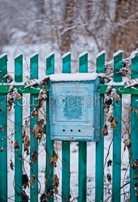 stock photo: close up of a mailbox on the street with blue fence-Raw Stock Photo ID: 68289