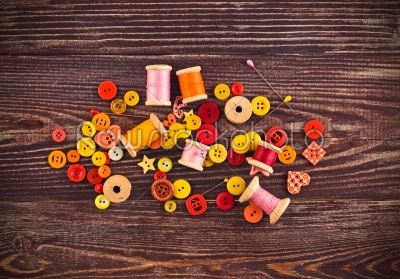 stock photo: collection of spools  threads in yellowred colors arranged on a grunge wooden box-Raw Stock Photo ID: 68356