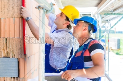 stock photo: construction workers on site checking quality-Raw Stock Photo ID: 49497