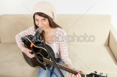stock photo: girl with a guitar and microphone-Raw Stock Photo ID: 53288