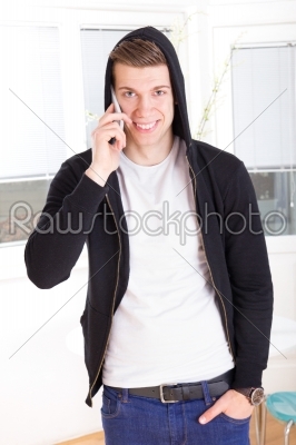 man with hooded on the phone