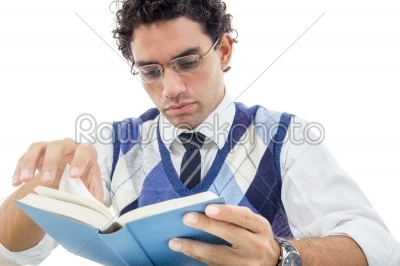 adult man in pullover with glasses sitting and reads book