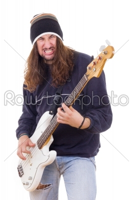 aggressive male musician playing bass guitar