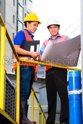 Architect and supervisor on construction site 