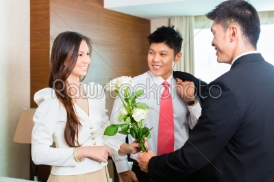 Asian Chinese hotel manager welcome VIP guests