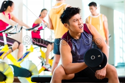 Asian people exercising sport for fitness in gym