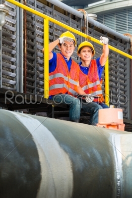 Asian technicians or workers on construction site