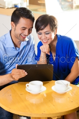 Asian woman and man in an coffee shop