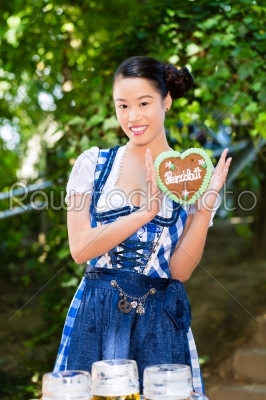 Asian Woman with Bavarian gingerbread heart