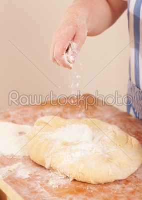 Baking biscuits - Woman kneads dough
