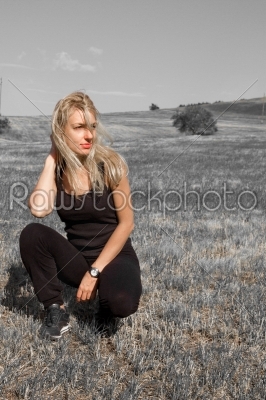 beautiful dreamy girl in the meadow toned in warm colors